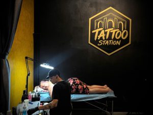 Tattoo artist creating a custom Fine Line Tattoo at Tattoo Station Hoi An studio